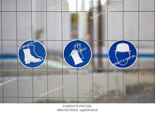 Different mandatory-signs on a construction site