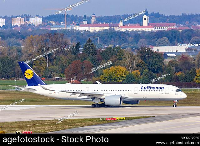 A Lufthansa Airbus A350-900 with the registration D-AIXE at Munich Airport, skyline of Freising, Germany, Europe
