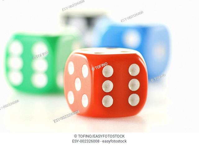 Composition with four colorful dices isolated on white