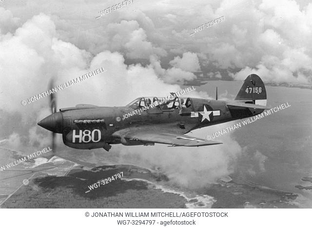 EUROPE -- 1940s -- A Curtiss P-40 in flight. This photo is probably from 1943 or 1944 and the fighter in question is probably being used for observation or...
