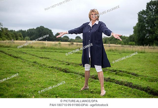25 June 2018, Germany, Buechten: The presenter Alida Gundlach stands on a field. Gundlach celebrates her 75th birthday on 17 July
