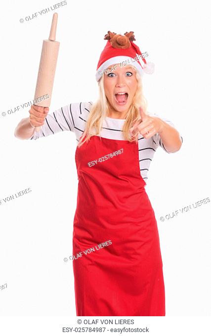 woman with santa hat and apron holding a rolling pin