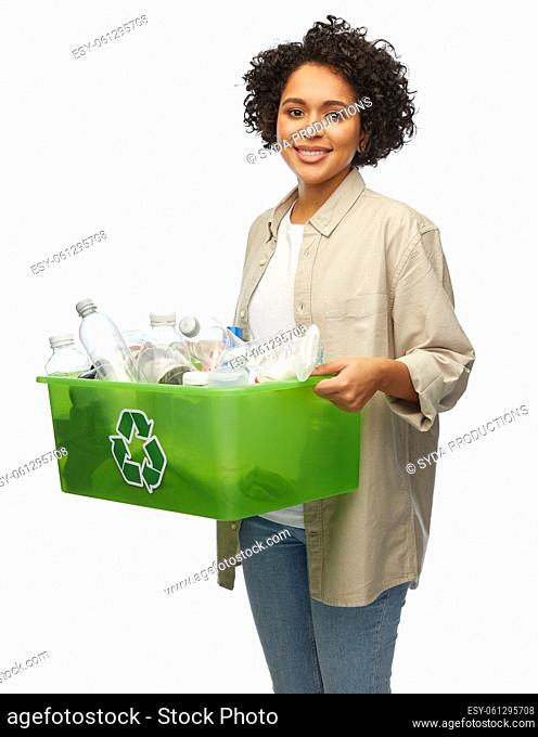 smiling woman holding plastic box with waste