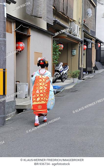 Maiko, Geisha apprentice, in the Gion quarter in Kyoto walking to Odori performance, Japan, Asia