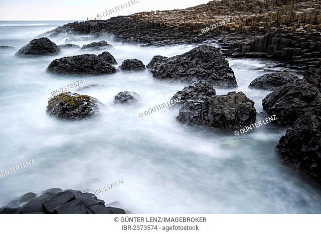 Basaltic rocks on the shore with waves, Giant's Causeway, Coleraine, Northern Ireland, United Kingdom, Europe