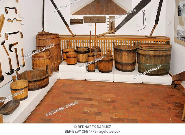 Castle of the Teutonic Order and West Kashubia Museum in town Bytow, Pomeranian Voivodeship, Poland. Wooden furniture and agricultural equipment