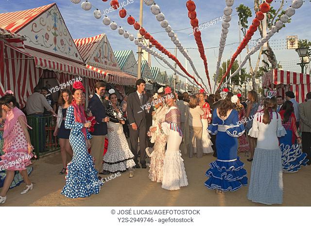 April Fair, Women wearing a traditional flamenco dress, Seville, Region of Andalusia, Spain, Europe