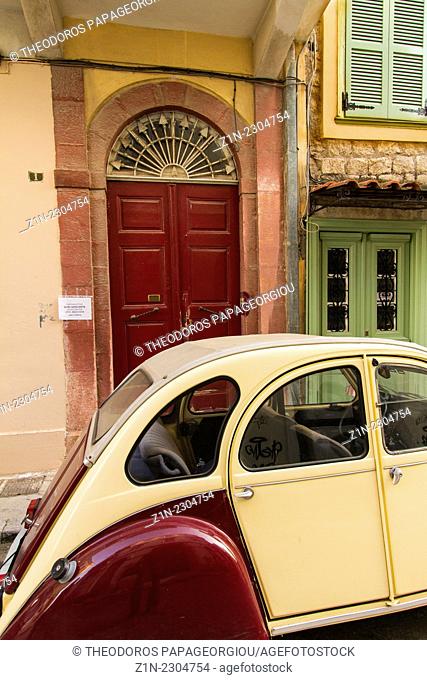 A Citroen 2CV, deux chevaux, parked in front of the entrance of a traditional house in Nafplion city. Argolis, Peloponnese, Greece