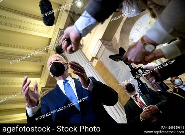 U.S. President Joe Biden speaks to reporters in the Hall of Columns following a ceremony on the first anniversary of the deadly insurrection at the U