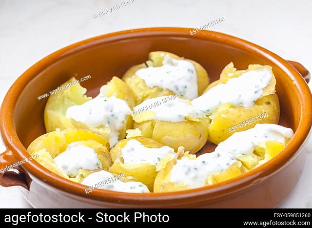 baked potatoes with yoghurt sauce and chive
