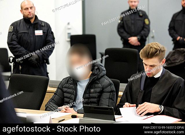 10 January 2023, Saxony, Dresden: A defendant (M) sits next to his lawyer in the courtroom of the Dresden Higher Regional Court before the trial on the jewel...
