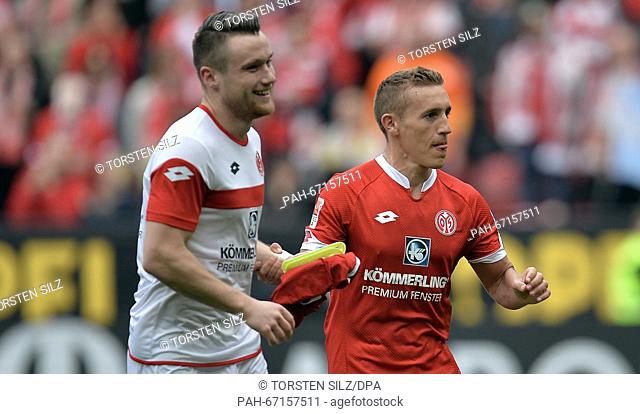 Mainz's goal-scorers Christian Clemens (L) and Pablo de Blasis celebrate Blasis' celebrate the victory after the German Bundesliga soccer match between FSV...