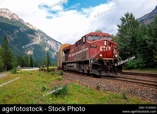 FIELD, CANADA - AUGUST 16, 2019: Train of Canadian Pacific Railway crossing the Rocky Mountains close to Field on August 16, 2019 in British Columbia, Canada