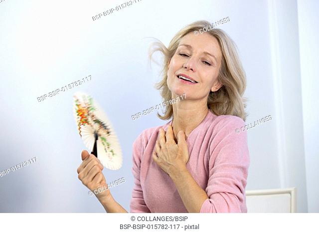 A menopausal woman having a hot flush