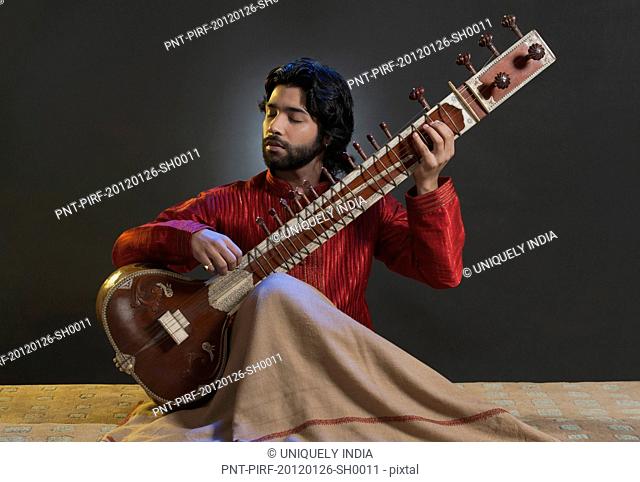 Musician playing a sitar