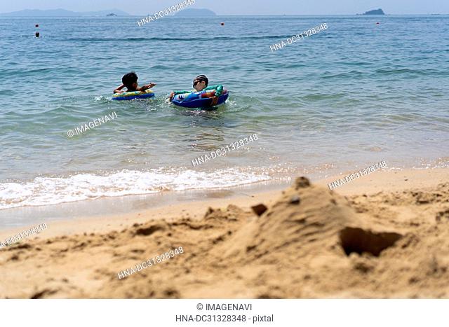 Boy Swimming in Beach