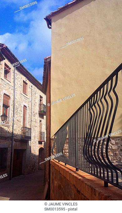 Sensation of depth and twist, in a narrow street of a town of Girona
