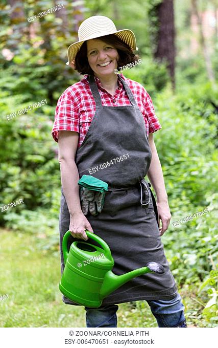 gardener with watering can