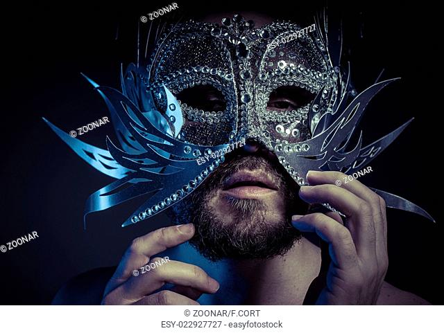 Ego, bearded man with silver mask Venetian style. Mystery and renaissance