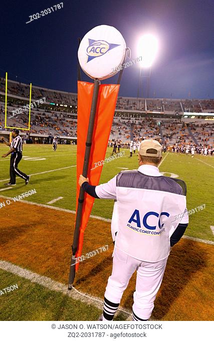 Oct 22, 2011; Charlottesville VA, USA; An ACC linesman with a distance marker on the sidelines during the fourth quarter between the Virginia Cavaliers and the...