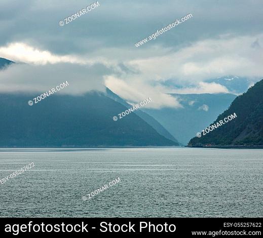 Beautiful summer cloudy evening fjord view, Norway