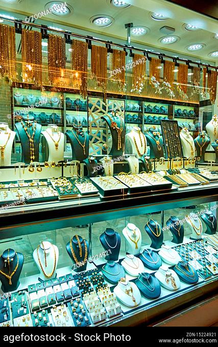 Dubai, UAE - January 31, 2020: Shop window of a jewelery store with gold ware at the Golden Souk market in Dubai, United Arab Emirates