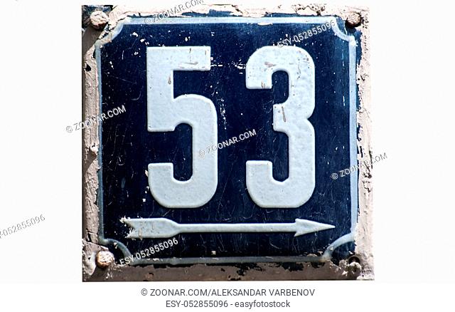 Weathered grunge square metal enameled plate of number of street address with number 53 closeup isolated on white background