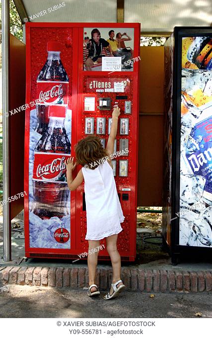 Little girl with drinks vending machine