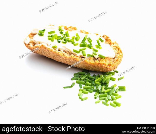 Crispbread with creamy cheese and green chive. isolated on white background