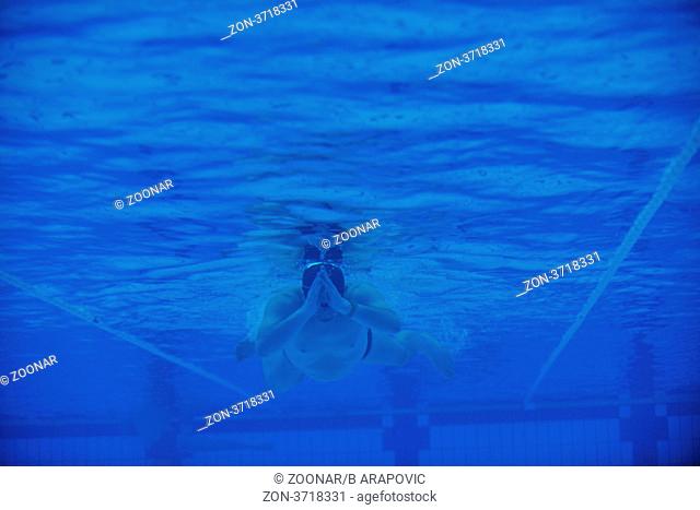 sport swimming pool underwater with blue color and swimmers
