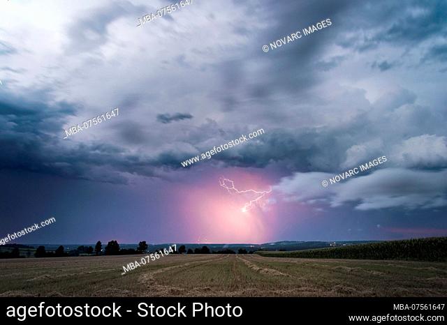Precipitation illuminated by lightning on the back of a withdrawing supercell near Feuchtwangen, Baden-Wrttemberg, Germany