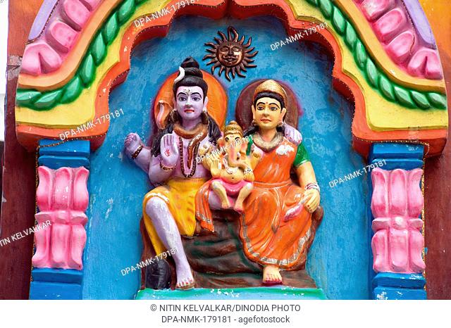 Idols of Lord Shiva with Parvati and infant Ganesh at Pune Maharashtra India 2011