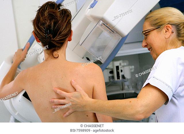 Model and health professional.Photo essay at Rouen University Hospital. Mammogram. Patient and woman technician