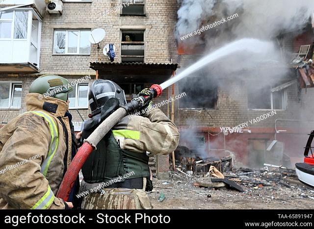 RUSSIA, DONETSK - DECEMBER 19, 2023: Firefighters battle a fire at an apartment block after shelling in the Kiyevsky neighbourhood