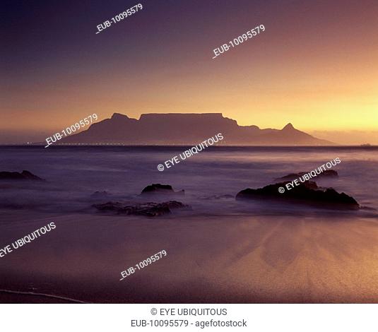 View of Table Mountain at dawn taken from Bloubergstrand shore line