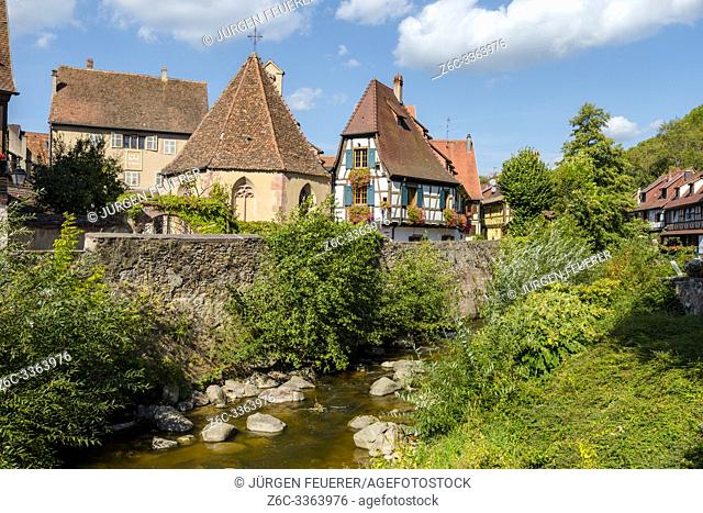 Chapelle de l'Oberhof in the medieval center of the village Kaysersberg, Alsace, Wine Route, France, old half-timbered houses at the brook side