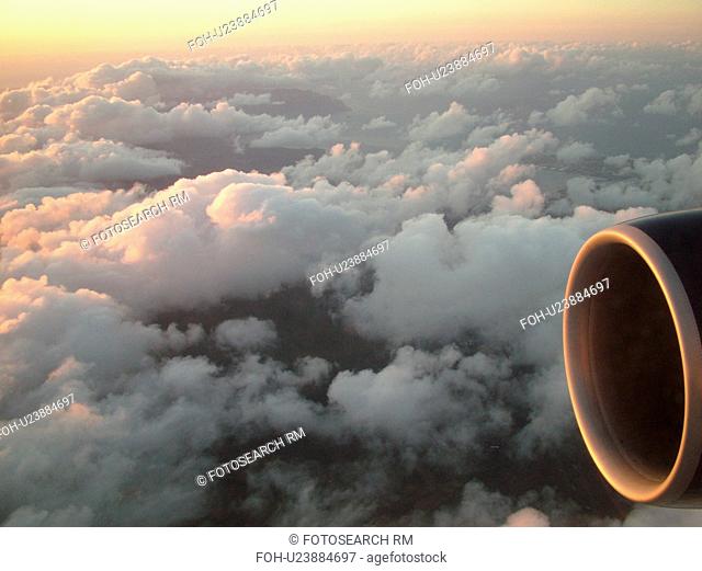 Aerial, airplane flying over the Pacific Ocean, clouds