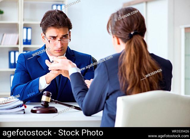 Lawyer talking to his client in office