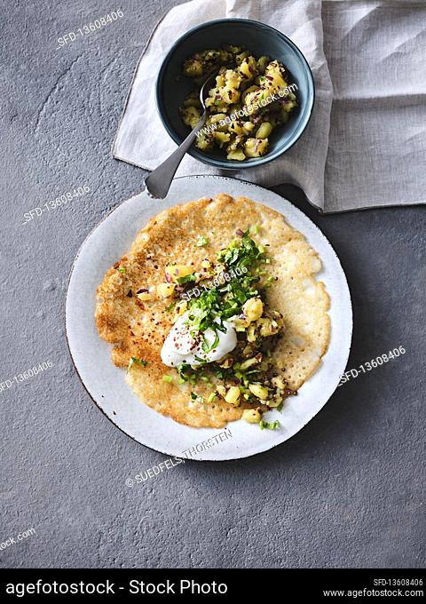 Indian dosas made of rice-lentil dough with spicy potato filling