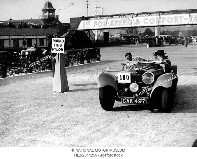 1938 S.S. 100 at Brooklands suring Junior Car Club event 25th March 1939 Artist: Unknown