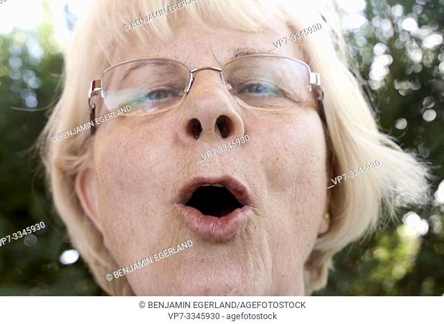 headshot of communicative senior woman speaking