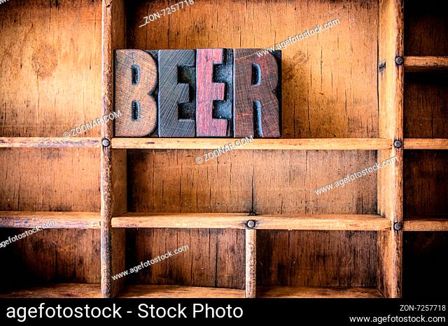 The word BEER written in vintage wooden letterpress type in a wooden type drawer
