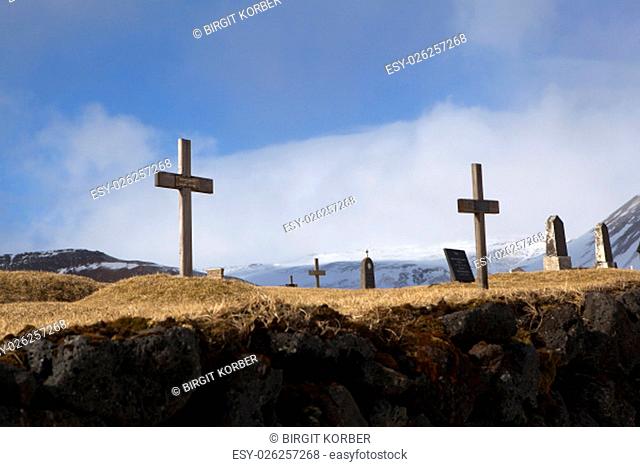 Graveyard at the black church of Budir in Iceland, springtime