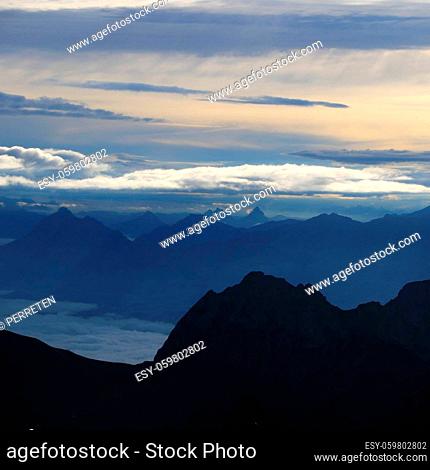 Dramatic morning sky over Mount Stanserhorn and other mountains of the Swiss Alps
