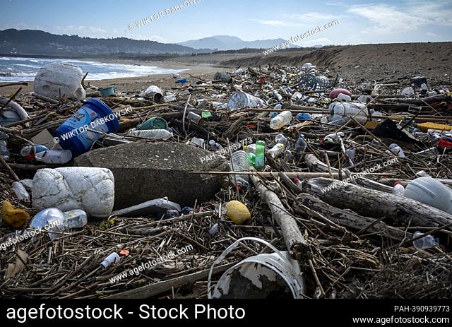 Beach polluted with remnants of fishing nets, foam sea buoys used by fishermen and plastic, mainly soda bottles near Keelung