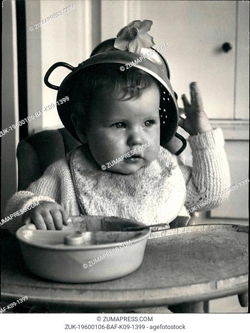 1962 - Summer headgear - for Jacqueline : Feminine habits are starting young in ?-month-old Jacqueline Pratt of Sander-stead, Surrey