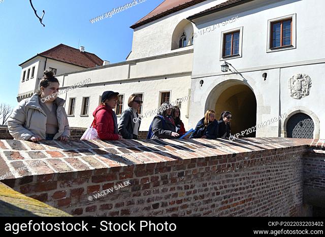 Ukrainian guide Larisa Tkachuk (center), who has lived in Brno, Czech Republic, for a long time, takes her compatriots through Brno, on March 22, 2022