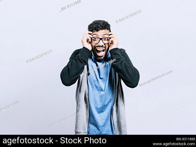 Surprised person opening his mouth, Surprised people with dumbfounded face on isolated background, astonished man holding his head