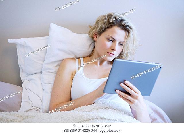 Woman using tablet computer
