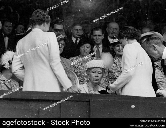 Lawn Tennis Championship Finals At Wimbledon -- H.M. Queen Mary presents the ladies Gold Salver for the singles championship to Miss Louise Brough after her...